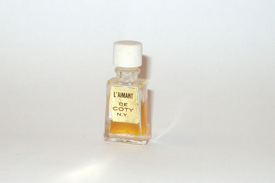 Miniature L'Aimant de Coty Etiquette Doré bouchon Strié Hauteur 4 cm 