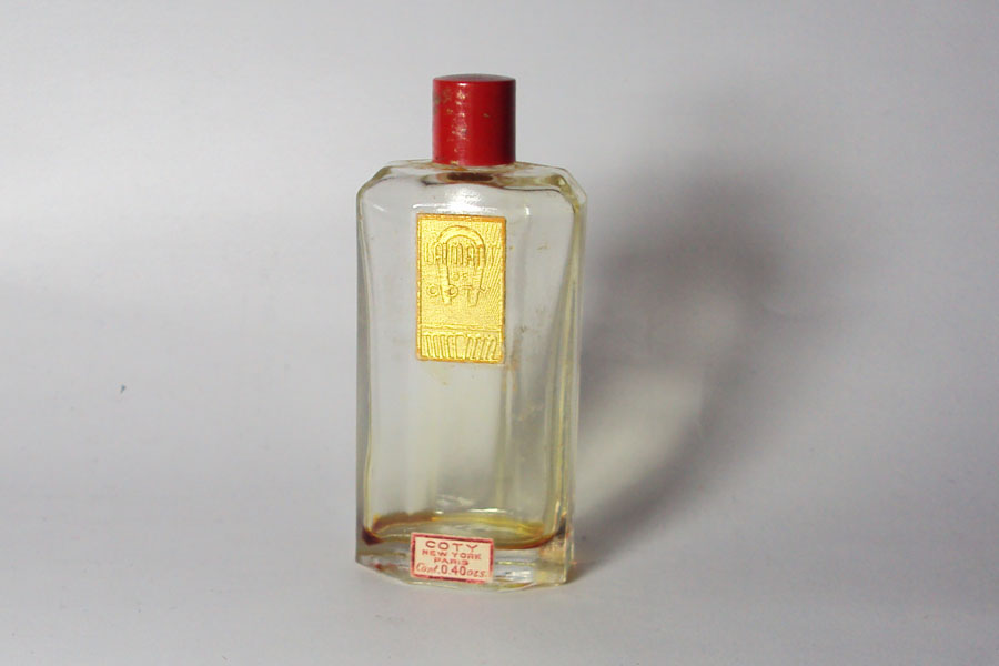 Flacon L'Aimant de Coty Bouchon Bakélite 0.40 Fl Oz Hauteur 6.5 cm 