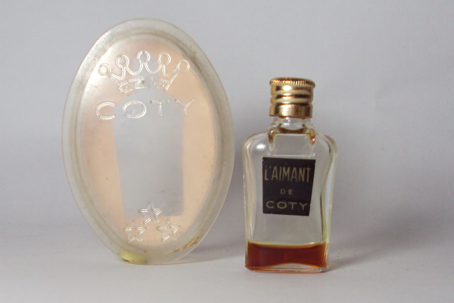 Miniature L'Aimant de Coty Hauteur 4.7 cm dans une boite plexi  
